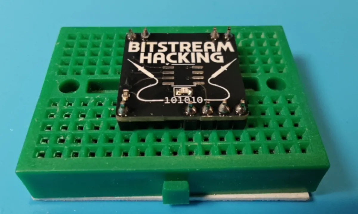 All nine header pins soldered, each with a neat cone of solder