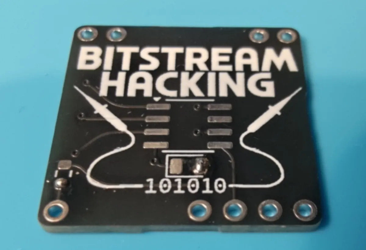 Bare board with a solder blob on the right-hand LED pad and on the lower resistor pad